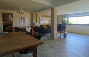 a living room with a table and a couch at Casa Cotera in Sierra