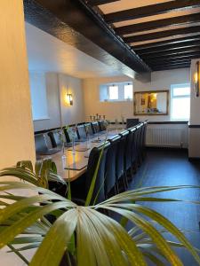 a conference room with a long table and chairs at Lake District Pub with 10 en-suite rooms in Hawkshead