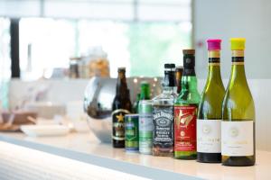 a group of bottles of wine sitting on a counter at Kanazawa Tokyu Hotel in Kanazawa