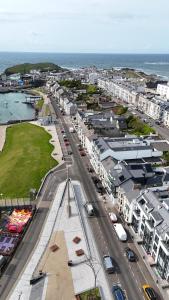 an aerial view of a city with buildings and a street at Atlantic View - Portrush in Portrush