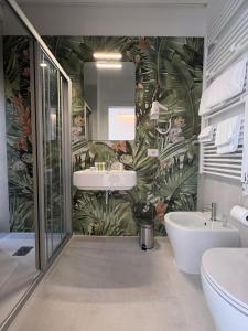 a bathroom with a sink and a mirror at Ruffini Boutique Rooms in Ascoli Piceno +21 photos