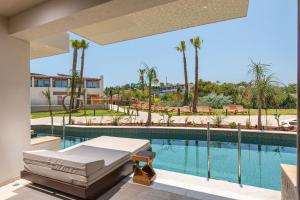 a view of a swimming pool from a house at Gouves Waterpark Holiday Resort in Gouves