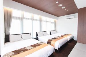 Ένα ή περισσότερα κρεβάτια σε δωμάτιο στο The Arbor HOTEL