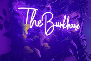 a neon sign that reads the buildup on a purple background at 1 Bed Flat - Sleeps 5 - Pet friendly - Parking in South Shields
