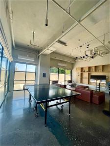 an empty room with a ping pong table in it at Peaceful Studio at The Median - City Skyline View, Short Walk to IT Park in Cebu City