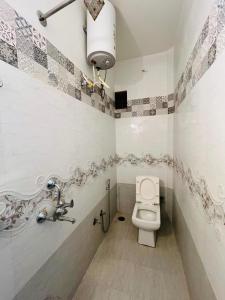 a bathroom with a toilet and a sink at Hostel The Travellers Heaven in Jaisalmer