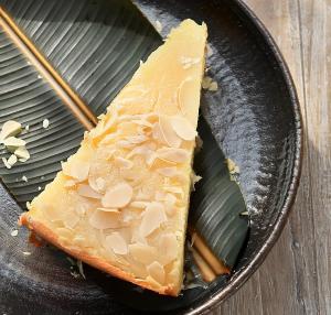 a piece of cheese with almonds on a plate at Mojo in Kalpitiya