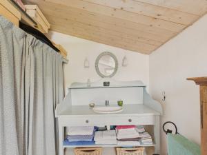 a bathroom with a sink and a mirror at 800 m de la plage, maison pour 4 avec terrasse in La Rivière +22 photos