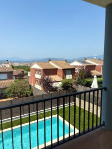 a view of a swimming pool from a balcony at Villa Marta - Girona in Girona