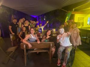 a group of people posing for a picture in a party at 1770 Beachside Backpacker & Motel in Agnes Water