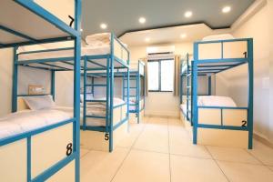 a room with blue bunk beds in a room at White Brown Apartment in Bangi