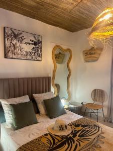 a bedroom with a bed with a table on it at Duplex Le Nusa in Perpignan