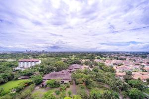 an overhead view of a city with a building and trees at Fairview House - Luxstay near Airport in Klapadua