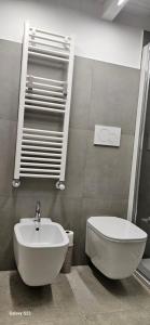a bathroom with a sink and a toilet at B&B Poggio dei Mori Appartamento 2 camere nel centro storico con WiFi e aria condizionata in Ruvo di Puglia +24 photos