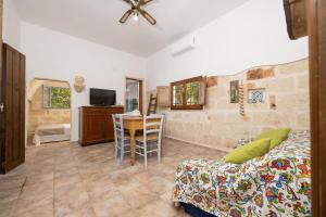 a living room with a couch and a table at Casa Varvodda in San Vito dei Normanni