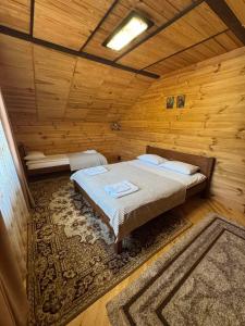 Postel nebo postele na pokoji v ubytování Дача Тиха