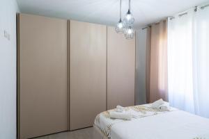 a bedroom with a bed and a large closet at Casa Sambò in Chioggia +13 photos