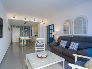 a living room with a couch and a table at Blue Horizon Mogan in Puerto de Mogán