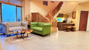 Coin salon dans l'établissement The Terraces - Kanatal