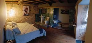 a bedroom with a bed and a sink in a room at Dona Remedios in Xermade