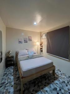 Ένα ή περισσότερα κρεβάτια σε δωμάτιο στο El Nido Lofts - The Apartment