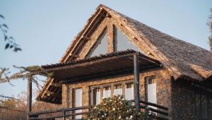 a building with a triangular window on the side of it at O'Leleshwa Retreat in Naivasha