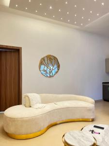 a living room with a large couch on the floor at Qelifox apartment service in Lekki