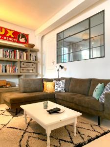 a living room with a couch and a coffee table at B&B Loft 57 in Amsterdam