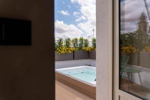 a hot tub on the balcony of a house at Casa Tre Archi - Camere Luxury in Altamura