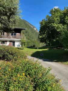 a house on the side of a road at Peaceful ground floor apartment in Saint-Gervais-les-Bains