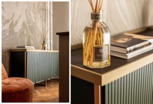 a bottle of whiskey sitting on top of a table at Aramis Deluxe Rooms in Florence