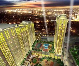 a view of a city at night with tall buildings at Cozy 1br with Netflix in Makati CBD in Manila