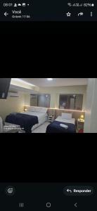 a picture of a room with two beds in it at Royal Flat ' Hotel, unidade nº 204 in João Pessoa