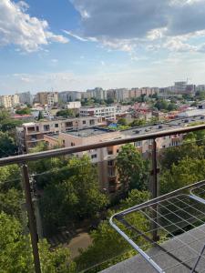 a view of a city from the balcony of a building at Ap nou cu 2 camere in centrul Bucureștiului in Bucharest