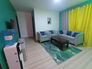 a living room with two couches and a table at Executive 1 bedroom house in Nairobi