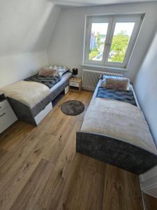 Postel nebo postele na pokoji v ubytování Monteurlodge Donaublick