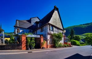 a building on the side of a street at Hotel - Garni - Wolfshof in Traben-Trarbach +46 photos