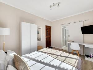 En eller flere senge i et værelse på Tranquil Garden Cottage