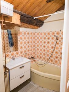 a bathroom with a tub and a sink and a shower at Le Nid D'Hauteluce - Proche centre ville in Hauteluce +26 photos