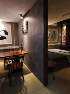 a room with a table and a bed in a room at Long Homestay A2-G08 in Ðức Hòa +12 photos