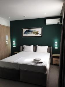 Ένα ή περισσότερα κρεβάτια σε δωμάτιο στο Jayhun Hotel Urgench +24 φωτογραφίες