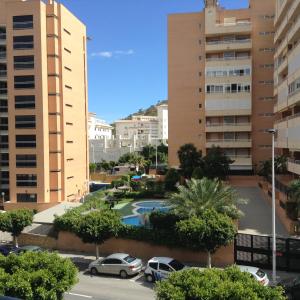 a view of a parking lot in a city with buildings at Benidorm La Cala Sidney in Cala de Finestrat