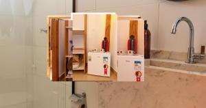 a kitchen with two refrigerators and a sink at Pousada e Chalé Lote 22 in Ilha do Mel +28 photos