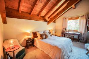 Postel nebo postele na pokoji v ubytování Chalet Merveille - Proche centre ville de Megève