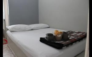Ένα ή περισσότερα κρεβάτια σε δωμάτιο στο Hotel Charm