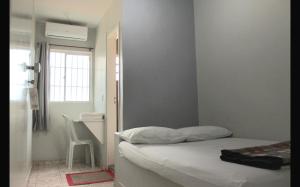 Ένα ή περισσότερα κρεβάτια σε δωμάτιο στο Hotel Charm