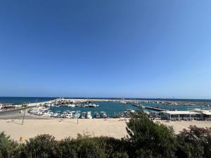 a view of a marina with boats in the water at Zygi Beachfront Retreat! in Zygi
