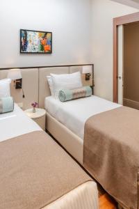 Cama o camas de una habitación en Cheya Deluxe Residence Nisantasi Istanbul City Center