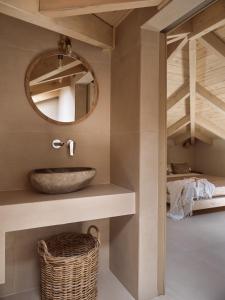 a bathroom with a sink and a mirror at Conte Maris IV in Tragaki