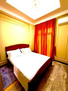 Ένα ή περισσότερα κρεβάτια σε δωμάτιο στο Boulevard Tashkent City 02